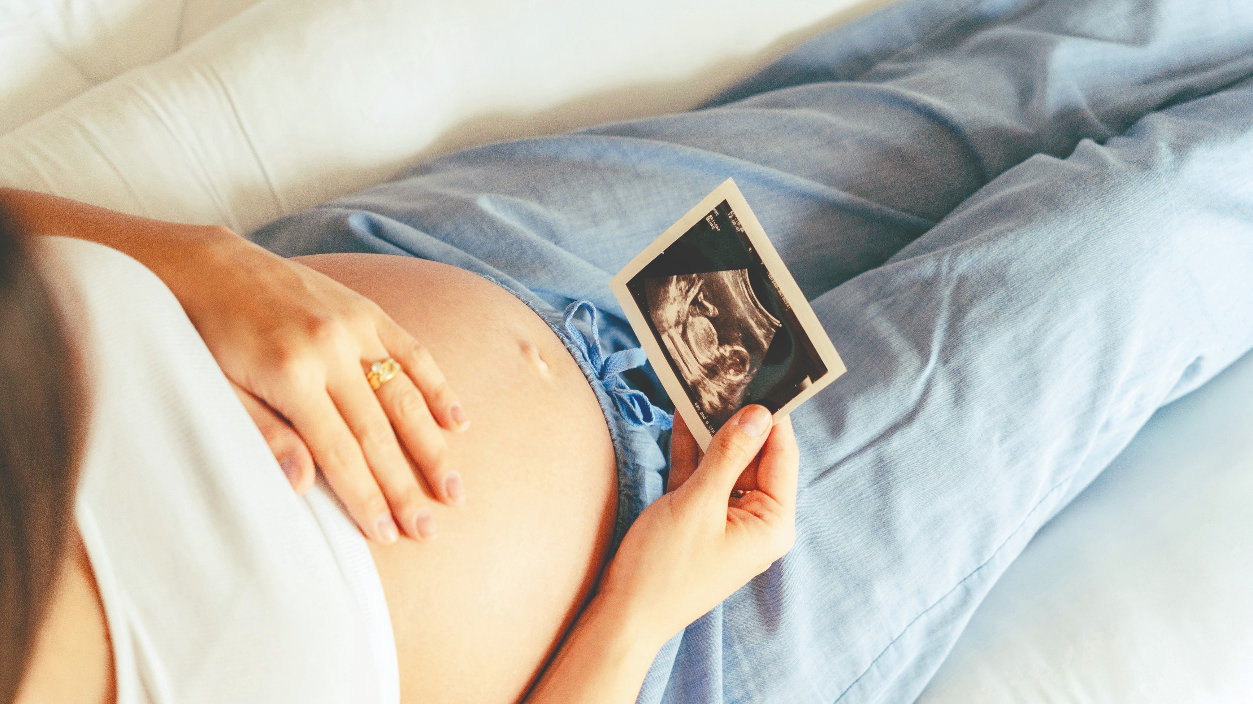 Delivery Plans - Woman holding ultrasound pregnancy picture.jpg